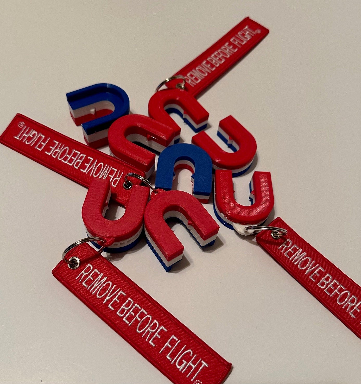 Red, White & Blue, RV Mini and Original and Airbrake Lockout Blocks with "Remove Before Flight tag."